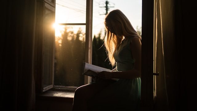 reading a book in a window